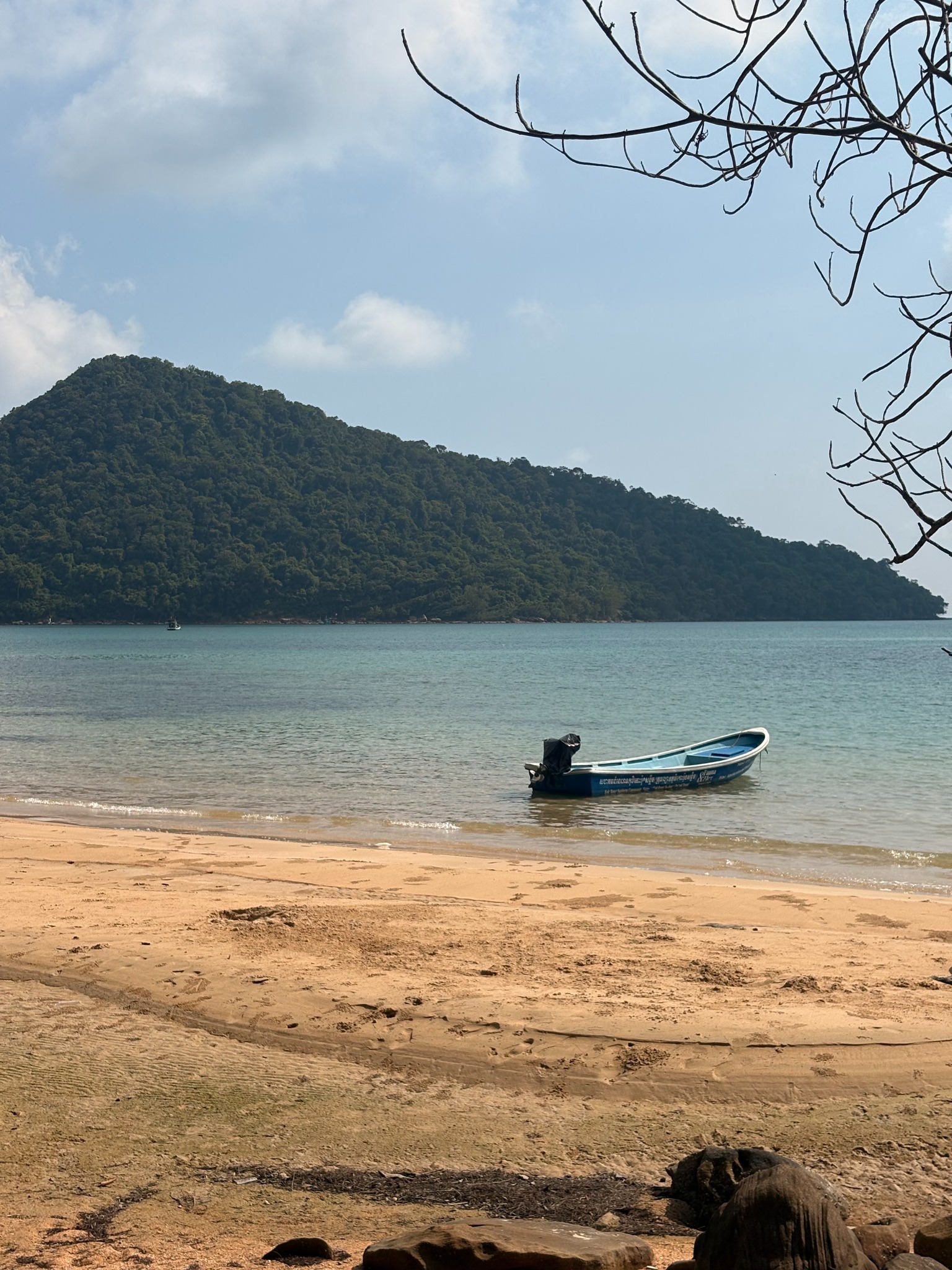 A quiet beach and boat from Ollie's Southeast Asia journey